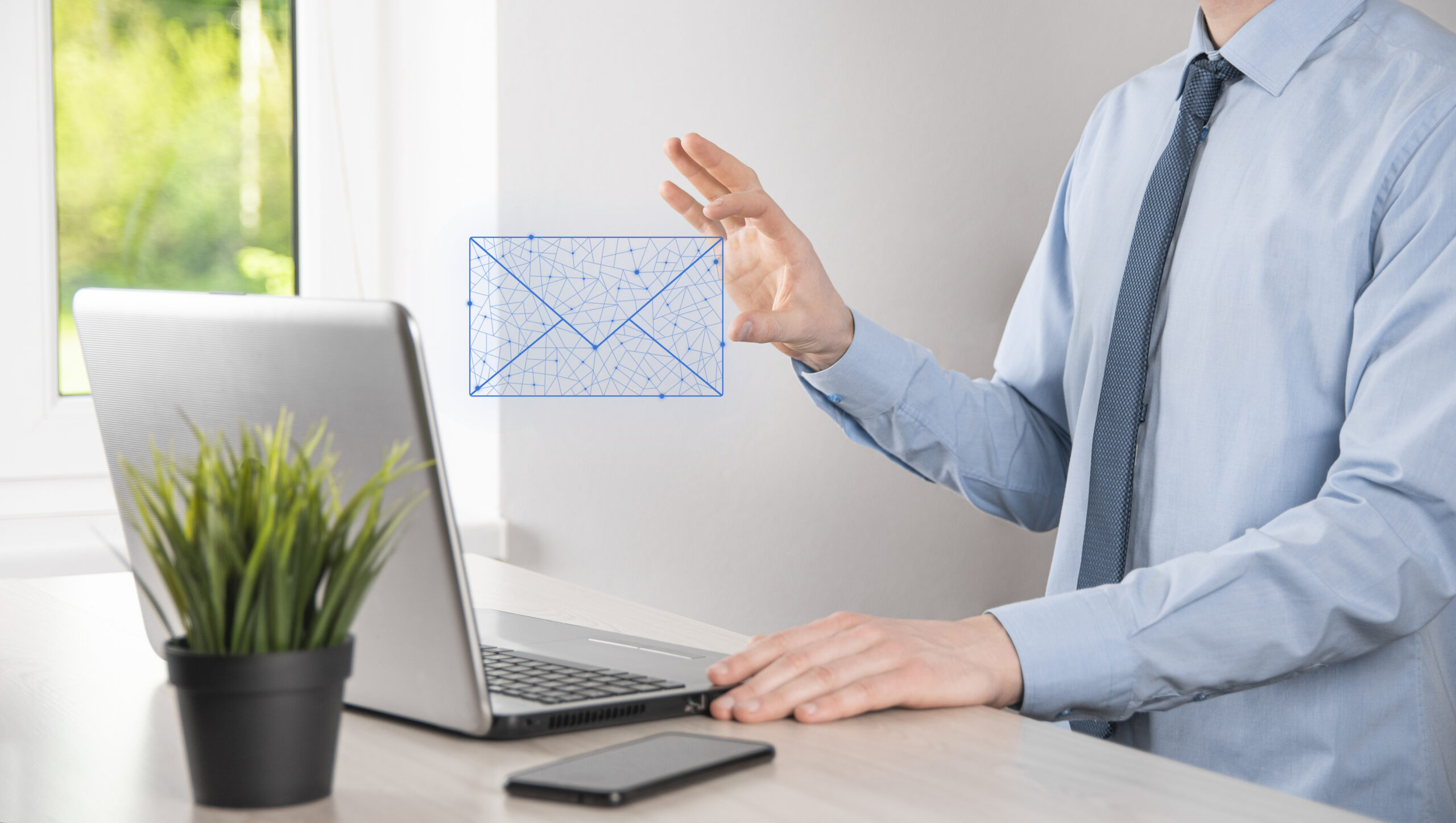 Male hand holding letter icon,email icons .Contact us by newsletter email and protect your personal information from spam mail. Customer service call center contact us. Email marketing and newsletter.